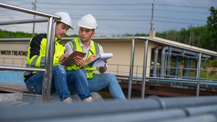 Two expert wastewater treatment engineers are planning to replace parts of a water filter in a...