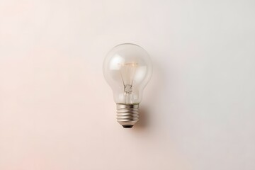 White lightbulb on pastel color background.