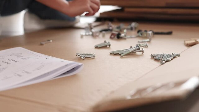 Assembling Furniture with Nuts and Bolts on Table