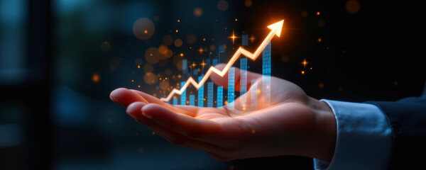 Rising glowing arrow chart with bar graph above open hand symbolizing growth and success in business and finance concept