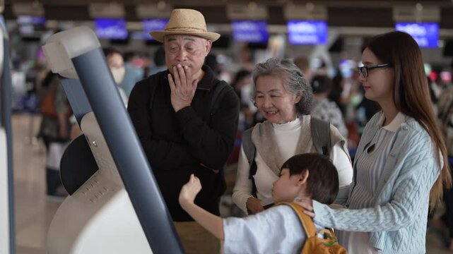 Asian family using airport self check-in kiosk together, multigenerational group interacting with digital screen, modern travel process with child exploring, technology and convenience for travelers