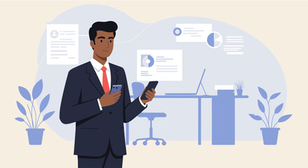 A stylishly dressed businessman of color uses his smartphone while standing near a desk with a computer and documents in a modern office setting.