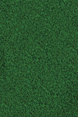 Artificial grass fake turf synthetic lawn field macro closeup, gentle shaded shadow area, green sports astroturf texture, vertical textured background pattern, large detailed copy space