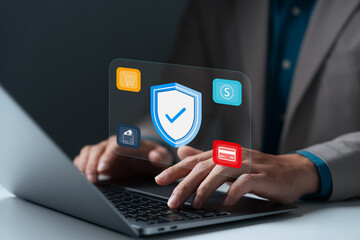 Cybersecurity concept showing businessman typing on laptop with secure online payment, data protection, e-commerce, privacy, financial security, and modern digital technology solution.