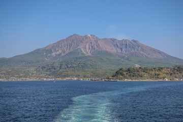 March 23 2025 Mountain and Coastal Town Near Tranquil Blue Water