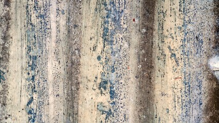 Grunge corrugated metal texture with peeling paint.