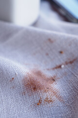 Coffee stain on white fabric in cozy cafe setting