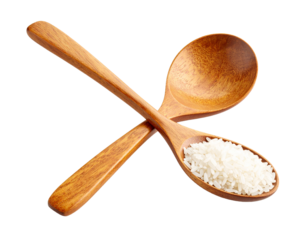 Pair of traditional wooden rice spoons arranged crosswise on transparent background.