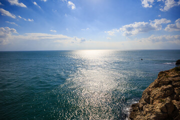 Calm blue sea and seaside rocks