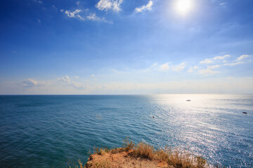 Calm blue sea and seaside rocks