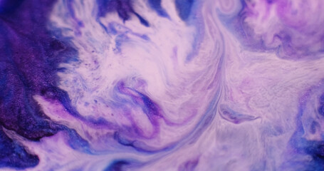 Ink water. Marble texture. Defocused purple blue pink color acrylic liquid fluid wet flow pigment floating on abstract art background.
