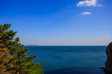 Calm blue sea and seaside rocks