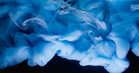 Cloud fume. Liquid splash. Defocused blue color paint water swirling smoke acrylic texture waving on creative dark black art abstraction.