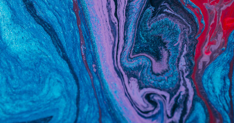 Liquid mix. Flowing ink. Defocused blue purple red color chemical particles purple water floating...