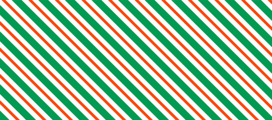 Bold vector pattern featuring diagonal stripes in green, orange, and white, creating a vibrant and energetic visual perfect for backgrounds, textiles, or modern design elements.