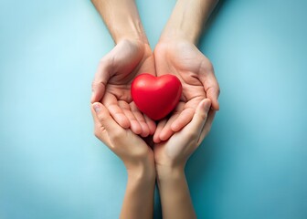 Obraz premium Happy Parents Day – Hands Holding Red Heart on Blue Background.