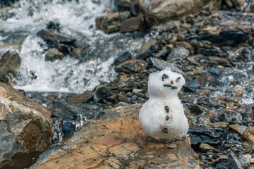 Snowman standing proudly on icy tongues of Martial Glacier
