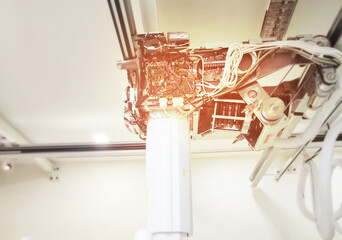 A detailed view of the internal mechanism of an advanced X-ray machine, showing the complex wiring and components that power the device for precision diagnostics.