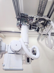 An intricate view of the mechanical and electronic components of an X-ray machine, showcasing the precision engineering that powers the diagnostic process in healthcare.