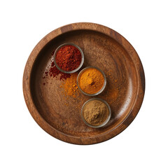 Three bowls of colorful spice powders arranged artistically on a rustic wooden plate set against a transparent background