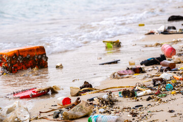 trash, plastic cups and plastic bags at the beach.environmental problem concept and healing the...