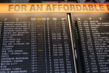 Main hall European airport main hall with black vintage mechanical flight information display...