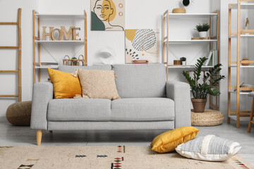 Interior of cozy living room with sofa and shelf units