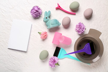 Blank card with hairdressing accessories, flowers and Easter decor on white grunge background