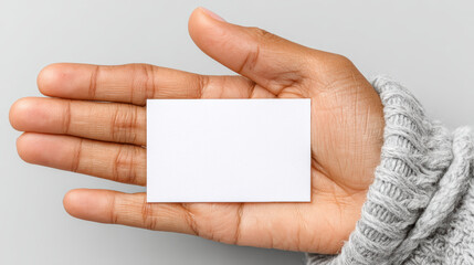 Obraz premium Hand holding blank card health insurance protection medical access concept with neutral background