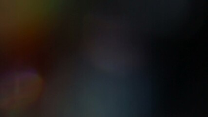 A beautiful, organic, and cinematic light leak and lens flare overlay with colorful rainbow refractions, perfect for adding a dreamy, vintage, or atmospheric effect - Powered by Adobe