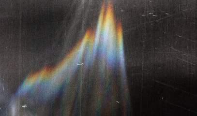 scratched vintage glass texture with iridescent rainbow light refraction, abstract grunge overlay...