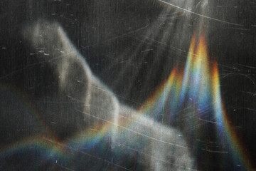 scratched vintage glass texture with iridescent rainbow light refraction, abstract grunge overlay...