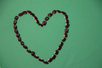Long Bean Seeds Organized in Artistic Love Shape

Heart-Shaped Layout of Long Bean Seeds for Decorative Art