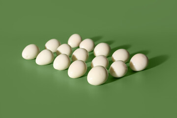 Fresh boiled quail eggs on green background