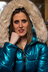 Businesswoman wearing winter coat with fur hood smiling