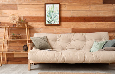 Stylish living room with comfortable sofa, shelving unit and picture