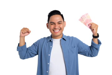Happy young Asian man in casual shirt holding money and showing biceps muscles isolated on transparent background. Profit and wealth concept