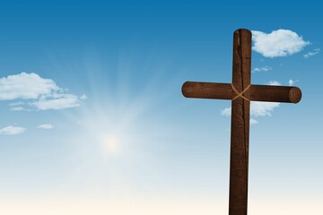 Flat design is showing rope-bound wooden cross against blue sky with sun rays and clouds