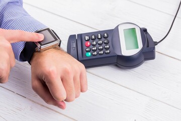 Man using smart watch to express pay