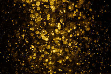 Blurred photo with golden dots visible glittering, shining brightly look and feel luxurious