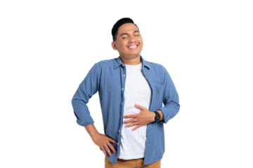 Portrait of young Asian man in casual shirt feeling happy after eating delicious food and rubbing his belly isolated on transparent background