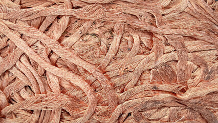 Artistically tangled copper wires creating a chaotic yet intriguing textural pattern with varying shades