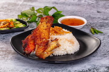 Spicy roasted chicken wing with rice