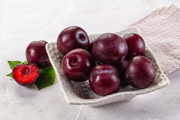 Raw ripe purple plum heap