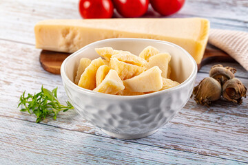 Parmesan cheese pieces in the bowl