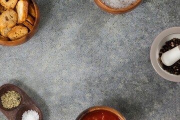 Food and spices arranged on gray table