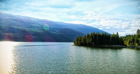 Idyllic view of river by mountains