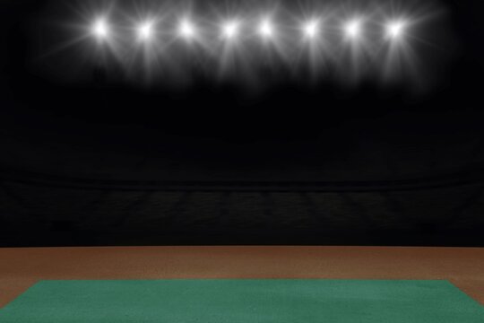 Fototapeta Sports field with lights against black background