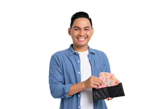 Successful financial planning. Smiling young Asian man in casual shirt taking money from wallet with happy facial expression isolated on transparent background