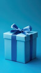   Blue gift box with blue bow on blue background 